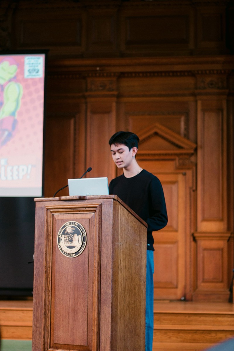 Speaking in front of the school about the importance of sleep at All School Meeting